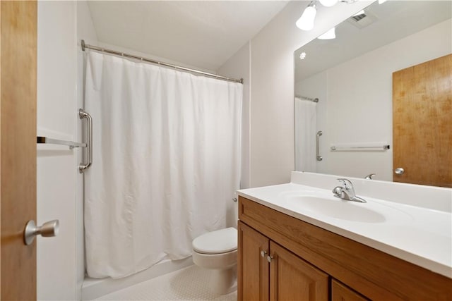 bathroom with vanity, toilet, and curtained shower