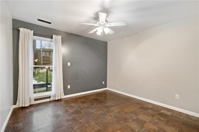 spare room featuring ceiling fan