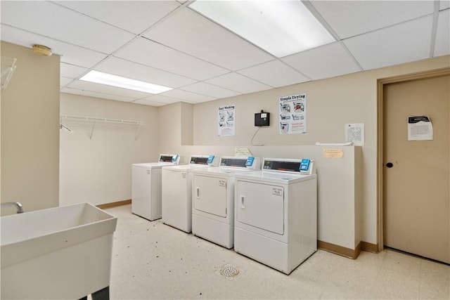 laundry room featuring separate washer and dryer and sink