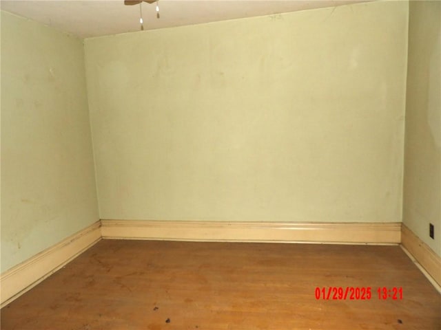 unfurnished room featuring ceiling fan and hardwood / wood-style floors