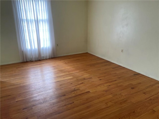 spare room featuring hardwood / wood-style floors