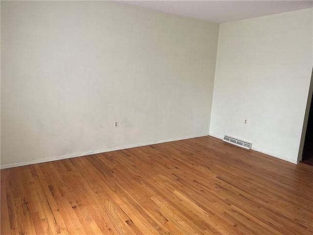 unfurnished room featuring wood-type flooring