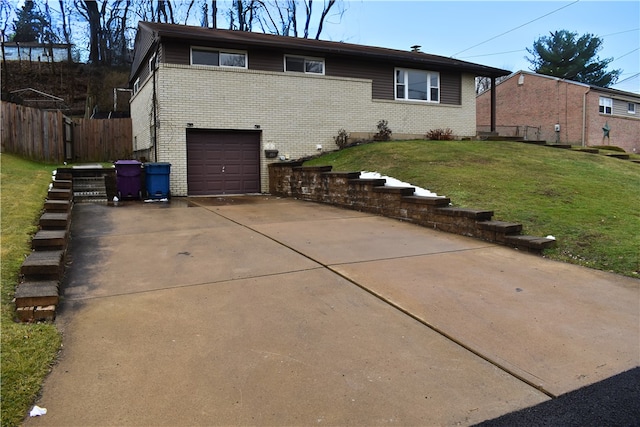 exterior space featuring a garage and a yard