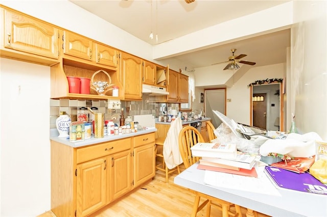 kitchen with tasteful backsplash, ceiling fan, and light hardwood / wood-style flooring