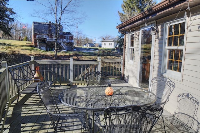 wooden terrace featuring outdoor dining space