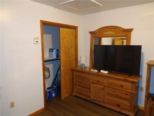 bedroom with dark wood-type flooring