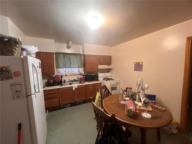 kitchen featuring white appliances and sink