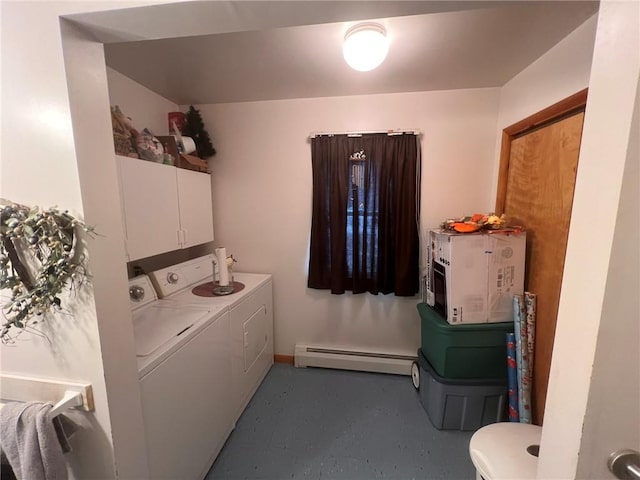 washroom with a baseboard radiator and washer and dryer