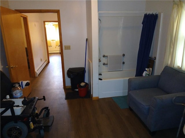 sitting room featuring hardwood / wood-style flooring and a baseboard radiator