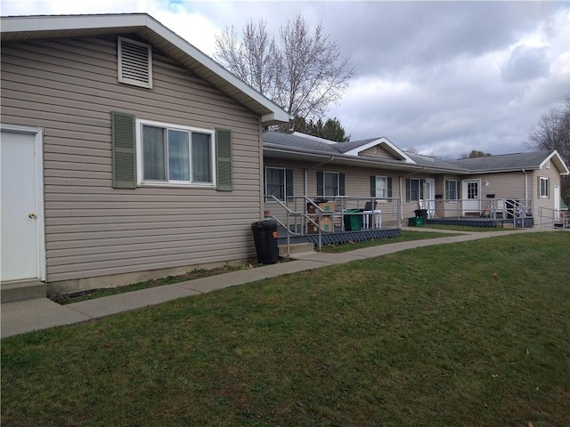 rear view of house with a lawn