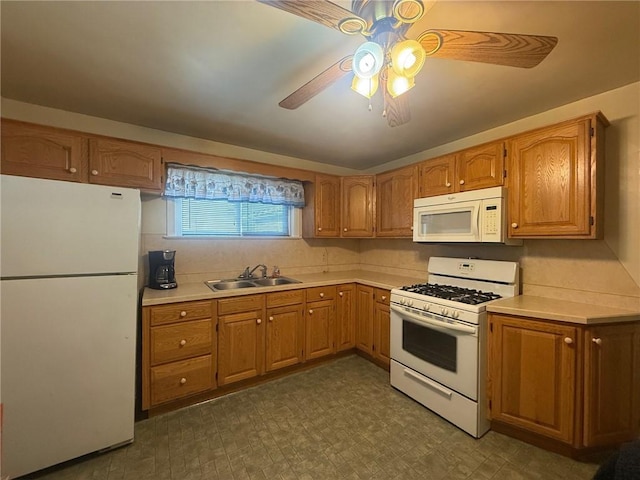 kitchen featuring sink, white appliances, and ceiling fan