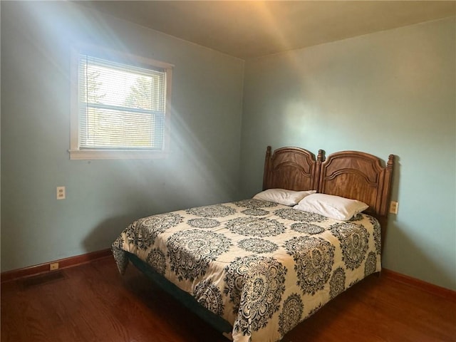 bedroom featuring dark hardwood / wood-style floors