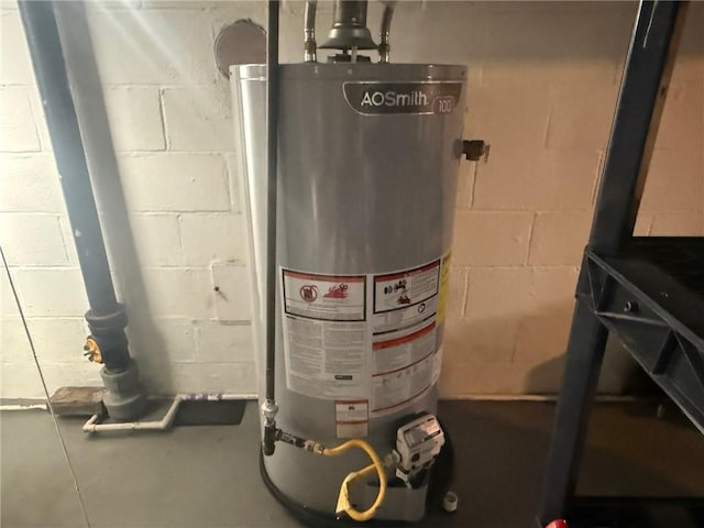 utility room featuring gas water heater