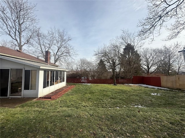 view of yard with a sunroom