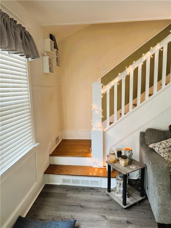 stairway featuring hardwood / wood-style floors