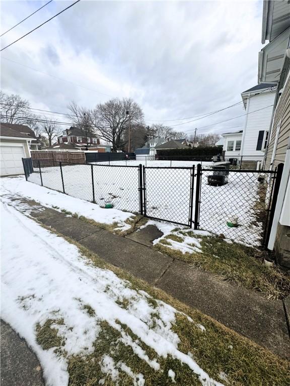 view of yard layered in snow