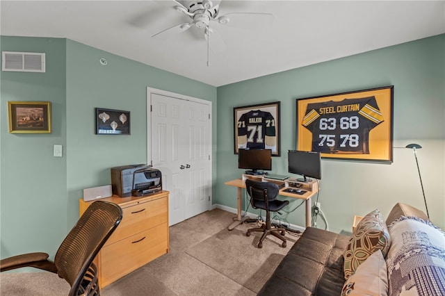 home office featuring ceiling fan and light colored carpet