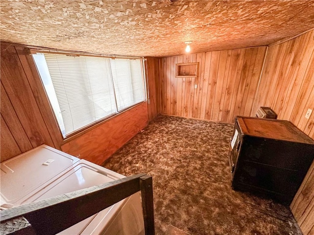 carpeted bedroom with wood walls