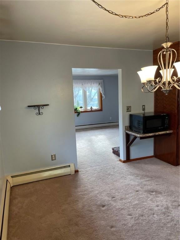 interior space featuring an inviting chandelier, a baseboard radiator, and carpet