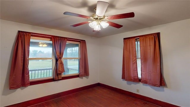 empty room featuring hardwood / wood-style flooring and ceiling fan