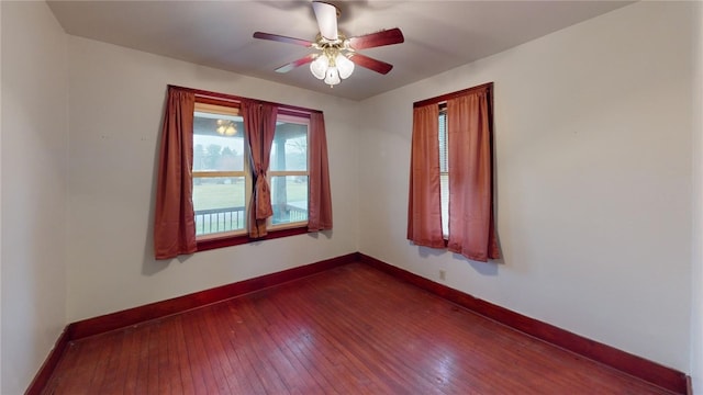 empty room featuring wood-type flooring and ceiling fan