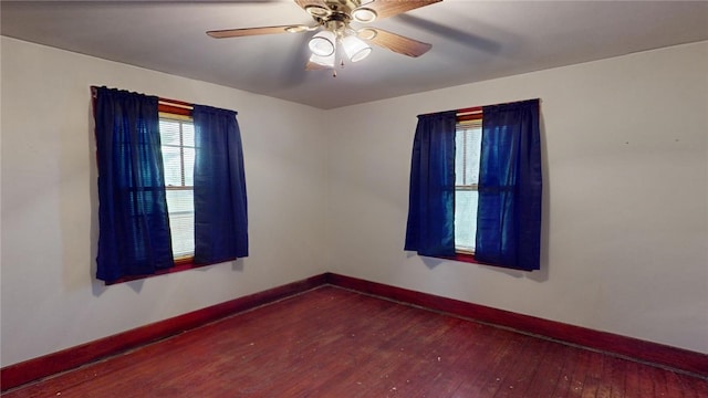 spare room featuring ceiling fan and hardwood / wood-style floors