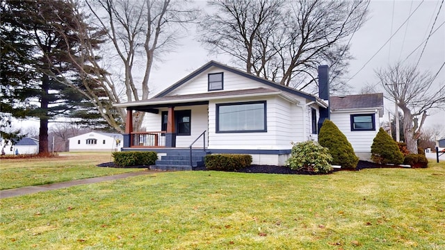 bungalow-style home with a front yard and a porch