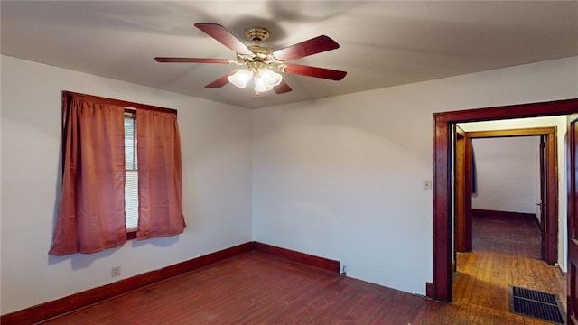 unfurnished room featuring ceiling fan and dark hardwood / wood-style floors