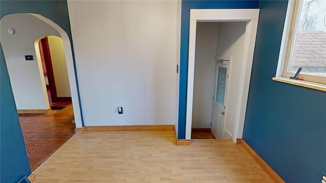 corridor featuring hardwood / wood-style floors