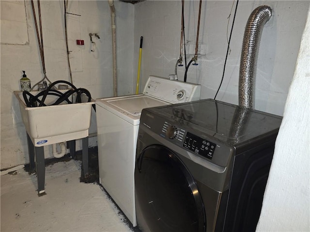 laundry area with washing machine and clothes dryer