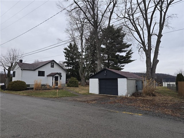 view of front of home featuring an outbuilding and a garage