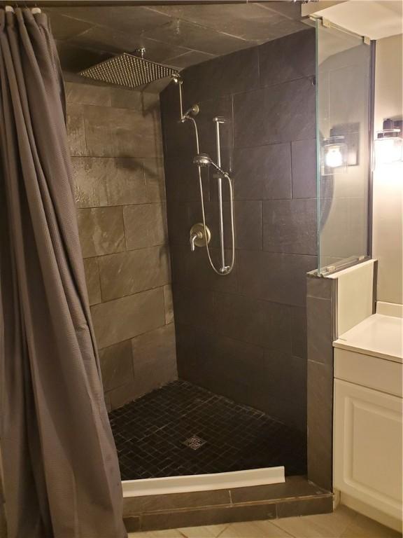 bathroom featuring vanity and a shower with curtain