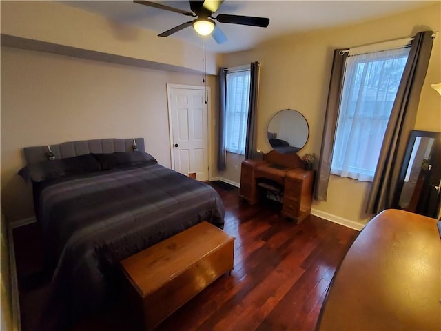 bedroom featuring dark hardwood / wood-style floors and ceiling fan