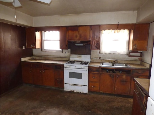 kitchen featuring ceiling fan, sink, and white range with gas stovetop