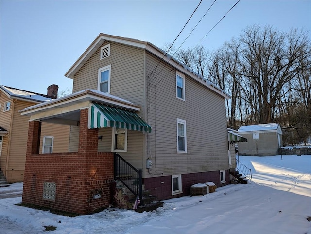 view of snow covered house