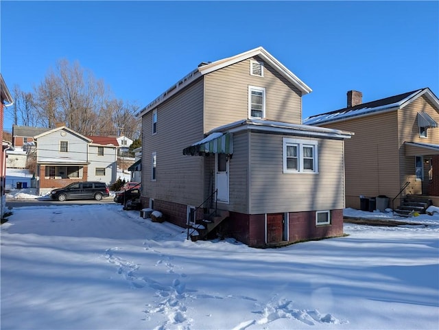 view of snow covered house