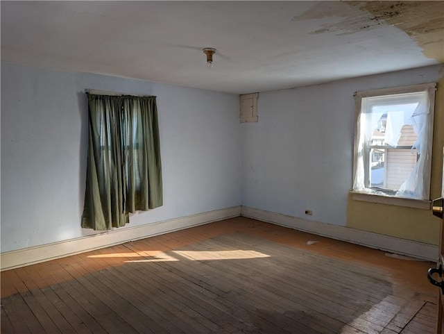 empty room featuring wood-type flooring