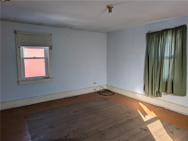 unfurnished room featuring dark hardwood / wood-style floors