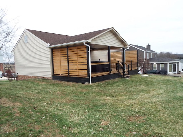 view of property exterior featuring a lawn