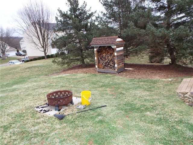 view of yard with an outdoor fire pit