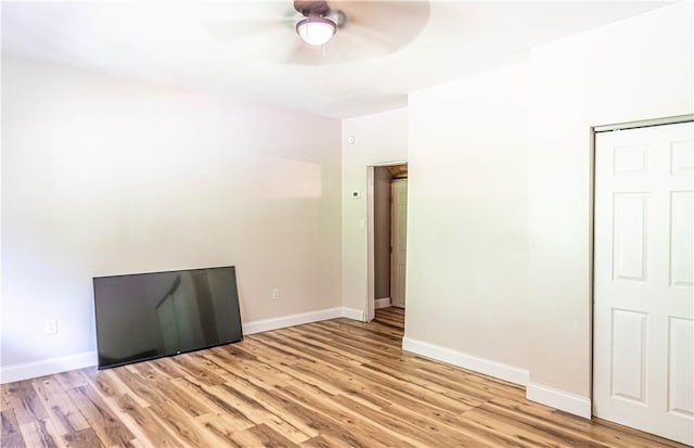 spare room featuring light hardwood / wood-style floors and ceiling fan