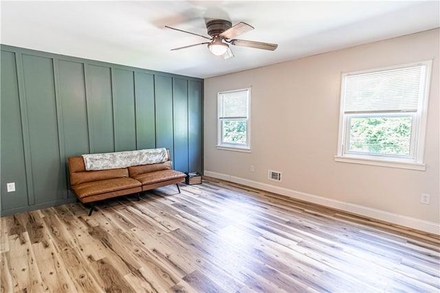 unfurnished room featuring light hardwood / wood-style floors and ceiling fan