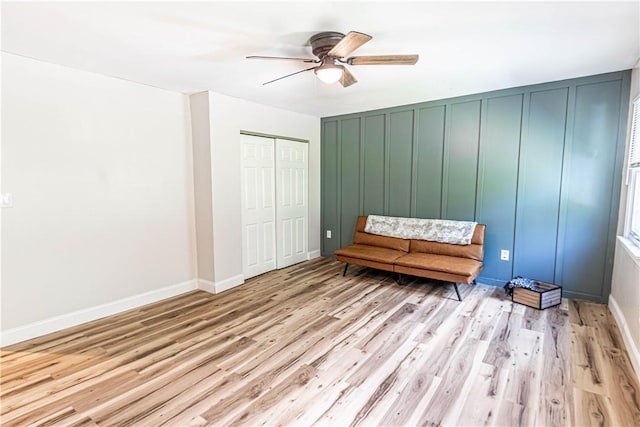 unfurnished room featuring ceiling fan and light hardwood / wood-style floors