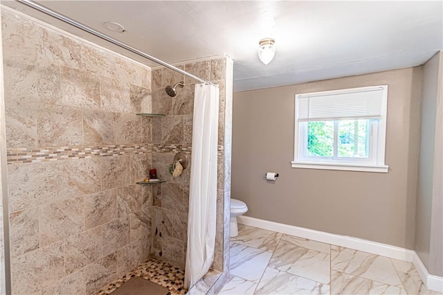 bathroom with a shower with curtain and toilet