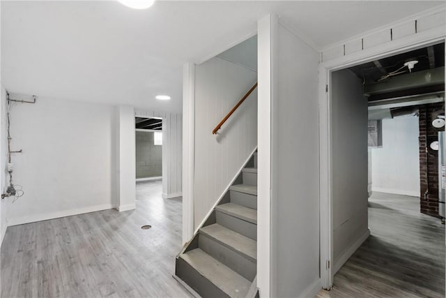 stairway featuring hardwood / wood-style flooring