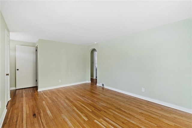 unfurnished room featuring light wood-type flooring