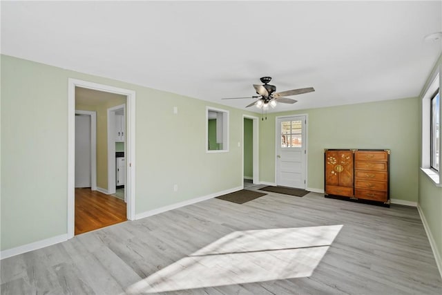 interior space with ceiling fan and light wood-type flooring