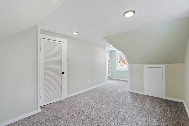 bonus room featuring carpet and lofted ceiling