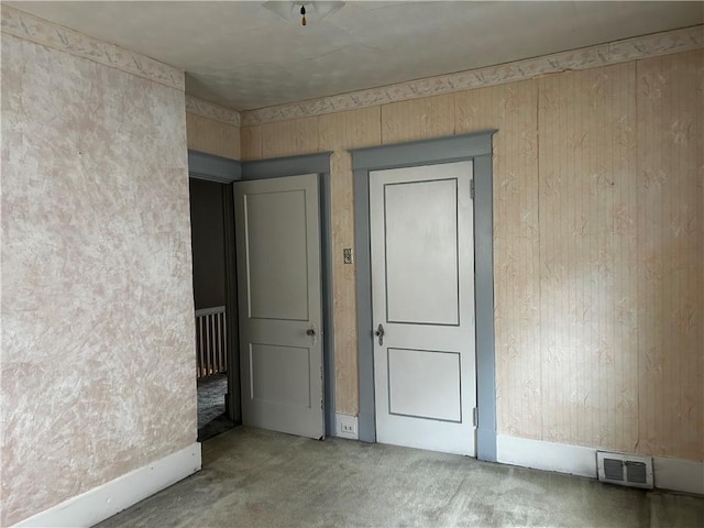 unfurnished room with carpet floors