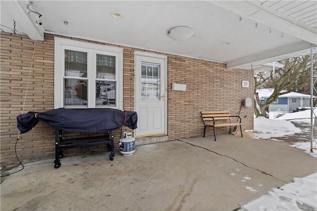 view of snow covered patio